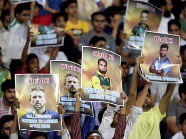 Pakistan cricket fans praise World XI players during the second Twenty20 match at the Gaddafi Cricket Stadium in Lahore, Pakistan, Wednesday, Sept. 13, 2017. (AP Photo/K.M. Chaudary)