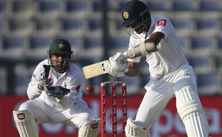 Sri Lanka's batsman Dinesh Chandimal plays a shot en route to his fifty. Chandimal was given leg before to Yasir Shah on 42, a decision which was overturned on review. His innings has included six boundaries. AP Sri Lanka's batsman Dinesh Chandimal plays a shot en route to his fifty. Chandimal was given leg before to Yasir Shah on 42, a decision which was overturned on review. His innings has included six boundaries. AP