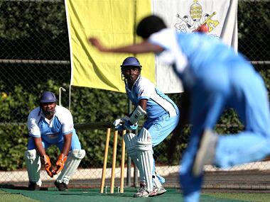 A player (C) from a team of priests and seminarians prepares to return a ball during a training session at the Maria Mater Ecclesiae’s Catholic College in Rome October 22, 2013. The Vatican officially declared its intention to defeat the Church of England on Tuesday - not in a theological re-match nearly 500 years after they split, but on the cricket pitch. The challenge was launched at the baptism of the St. Peter’s Cricket Club. Vatican officials said the league will be composed of teams of priests and seminarians from Catholic colleges and seminaries in Rome. REUTERS/Alessandro Bianchi (VATICAN - Tags: RELIGION SPORT CRICKET) - GM1E9AM1TO701