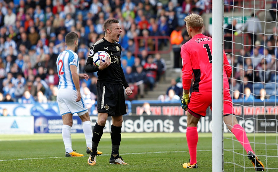 Jamie Vardy's penalty gave Leicester City a point at Huddersfield Town. Reuters Jamie Vardy's penalty gave Leicester City a point at Huddersfield Town. Reuters