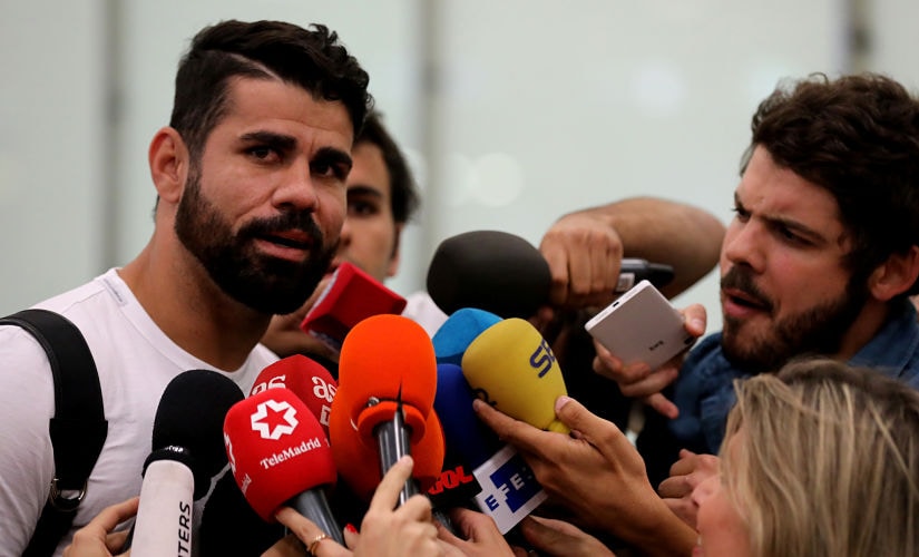 Spain's soccer player Diego Costa speaks to media upon arriving at Adolfo Suarez Madrid Barajas airport in Madrid, Spain, September 22, 2017. REUTERS/Sergio Perez - RC1168A8A820