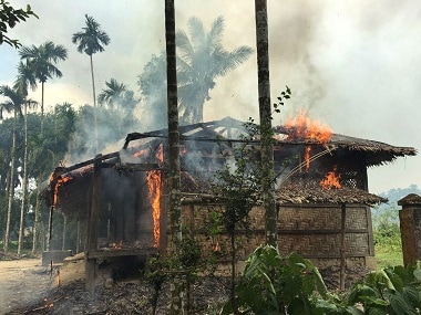 A house in northern Rakhine catches fire. AP