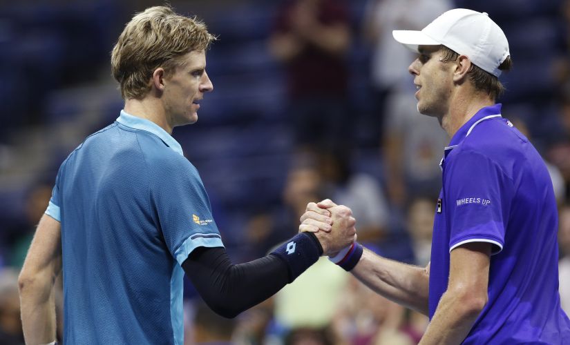 Sam Querrey, of the United States, right, congratulates Kevin Anderson, of South Africa,after Anderson upset him in a quarterfinal match at the U.S. Open tennis tournament in New York, Wednesday, Sept. 6, 2017. (AP Photo/Kathy Willens)