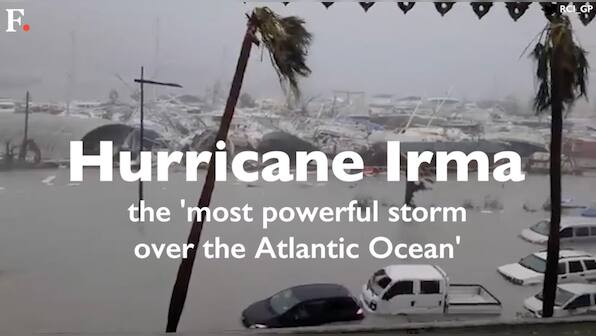 Irma weakens to tropical storm: One dead, around 800 flights cancelled as thousands struggle without power