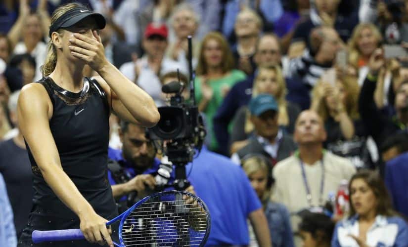 Maria Sharapova reacts after upsetting second seed Simona Halep in their opening round match in the U.S. Open tennis tournament in New York, Monday, Aug. 28, 2017. (AP Photo/Kathy Willens)