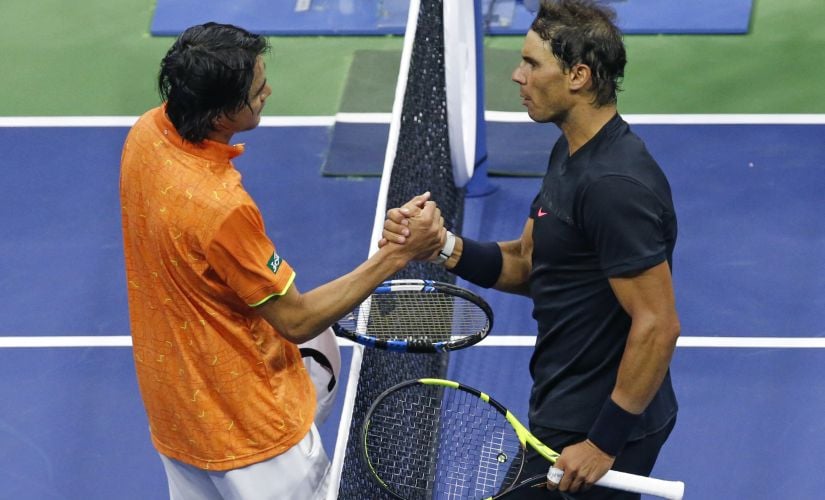Rafael Nadal, right, of Spain, greets Taro Daniel, of Japan, at the net after Nadal's win at the U.S. Open tennis tournament in New York, early Friday, Sept. 1, 2017. (AP Photo/Kathy Willens)