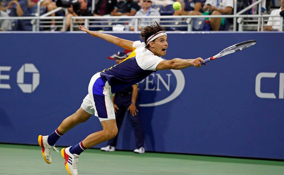 Dominic Thiem, of Austria, hits a return shot to Juan Martin del Potro, of Argentina, during the fourth round of the U.S. Open tennis tournament, Monday, Sept. 4, 2017, in New York. (AP Photo/Adam Hunger)
