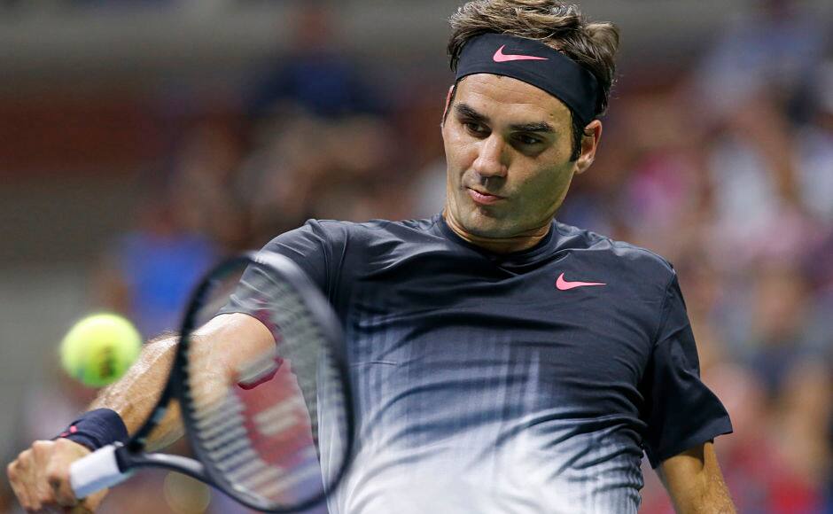 Roger Federer, of Switzerland, returns in a fourth-round match against Philipp Kohlschreiber, of Germany, at the U.S. Open tennis tournament in New York, Monday, Sept. 4, 2017. (AP Photo/Kathy Willens)