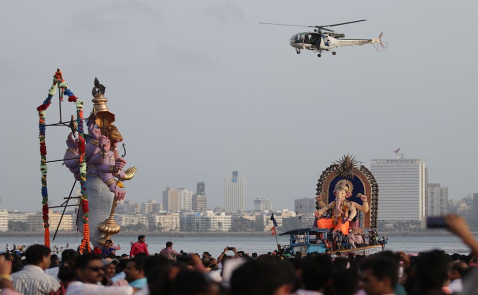 The idols were brought onto the roads to the accompaniment of 'dhols' (drums), cymbals, thousands dancing and chanting The idols were brought onto the roads to the accompaniment of 'dhols' (drums), cymbals, thousands dancing and chanting