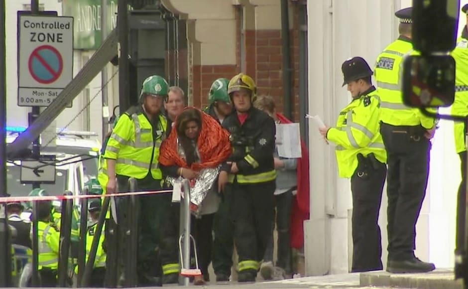 London Ambulance immediately sent several resources at the spot to help injured commuters. A woman with blankets wrapped around her is being escorted by emergency services near the scene of an explosion in London. AP London Ambulance immediately sent several resources at the spot to help injured commuters. A woman with blankets wrapped around her is being escorted by emergency services near the scene of an explosion in London. AP