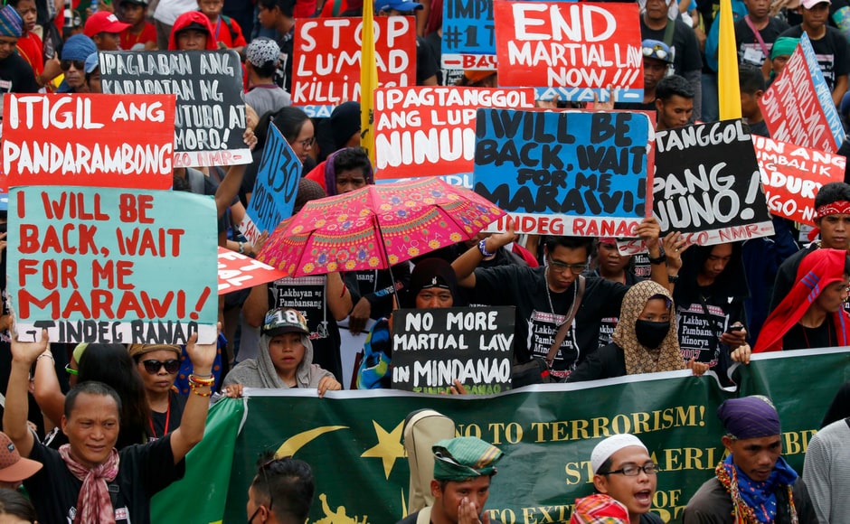 Protesters display placards during a rally near the Presidential Palace calling for an end to the killings in the so-called war on drugs of Duterte and his alleged Protesters display placards during a rally near the Presidential Palace calling for an end to the killings in the so-called war on drugs of Duterte and his alleged