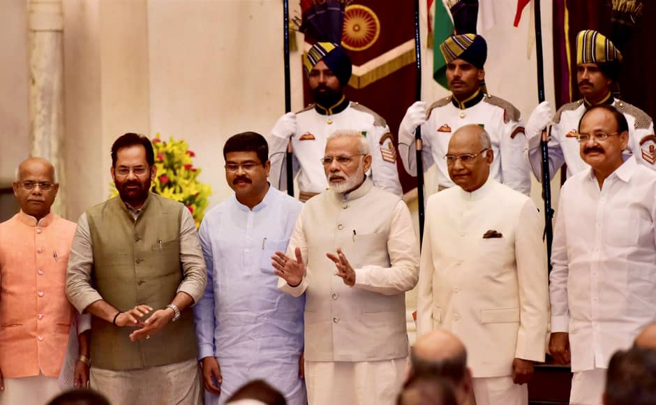President Ram Nath Kovind, Vice-President M Venkaiah Naidu, Prime Minister Narendra Modi poses with some new members of Cabinet after the reshuffle at Rashtrapati Bhavan in New Delhi on Sunday. PTI
