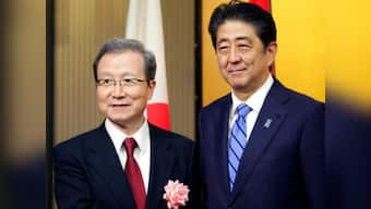 Shinzo Abe attends China's National Day celebrations, invites Xi Jinping to visit Japan