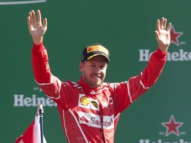 Ferrari driver Sebastian Vettel of Germany celebrates his third place after completing the Italian Formula One Grand Prix, at the Monza racetrack, Italy, Sunday, Sept. 3, 2017. (AP Photo/Antonio Calanni)