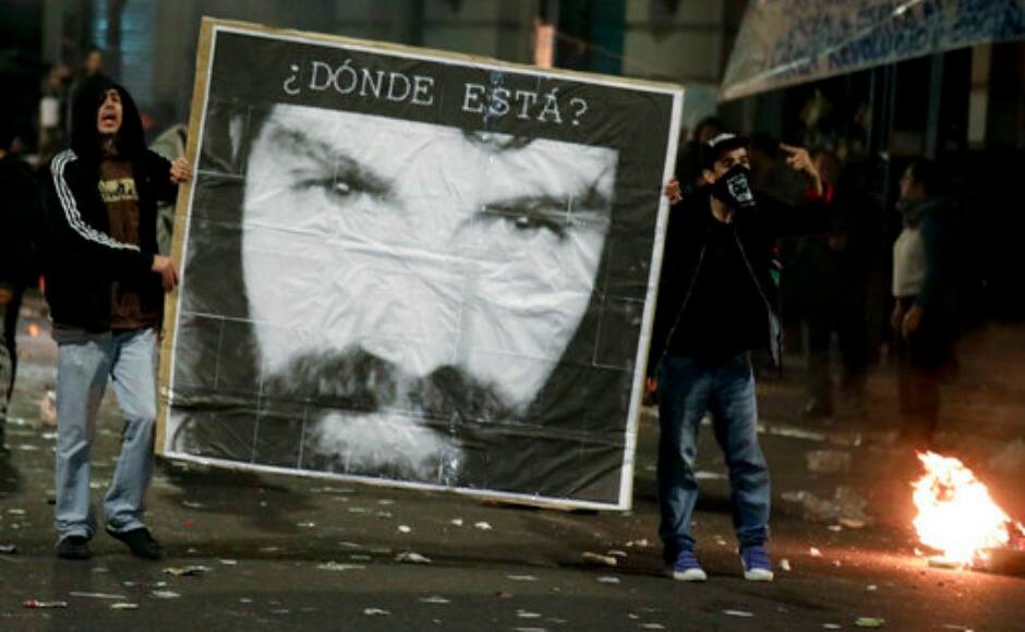 Thousands of Argentines demonstrated in cities across the country on Friday holding photos of a missing activist Santiago Maldonado. AP