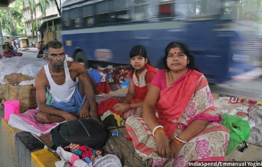 A cancer patient with his wife and son on the pavement near Tata Memorial Hospital. IndiaSpend.