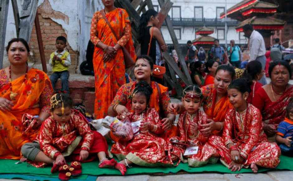 Nepalese women with their daughters wait for Kumari Puja. Devotees are known to touch the girls' feet with their foreheads. The act is considered to be the highest sign of respect among Hindus in Nepal. AP Nepalese women with their daughters wait for Kumari Puja. Devotees are known to touch the girls' feet with their foreheads. The act is considered to be the highest sign of respect among Hindus in Nepal. AP