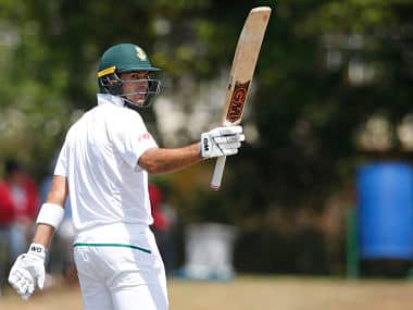 South African batsman Aiden Markram raises his bat as he celebrates scoring half century (50 Runs) during the first day of the first Test Match between South Africa and Bangladesh on September 28, 2017 in Potchefstroom, South Africa. / AFP PHOTO / GIANLUIGI GUERCIA