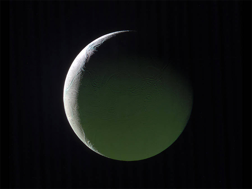 NASA releases image of a brightly lit crescent on Enceladus captured by the Cassini mission to Saturn NASA releases image of a brightly lit crescent on Enceladus captured by the Cassini mission to Saturn