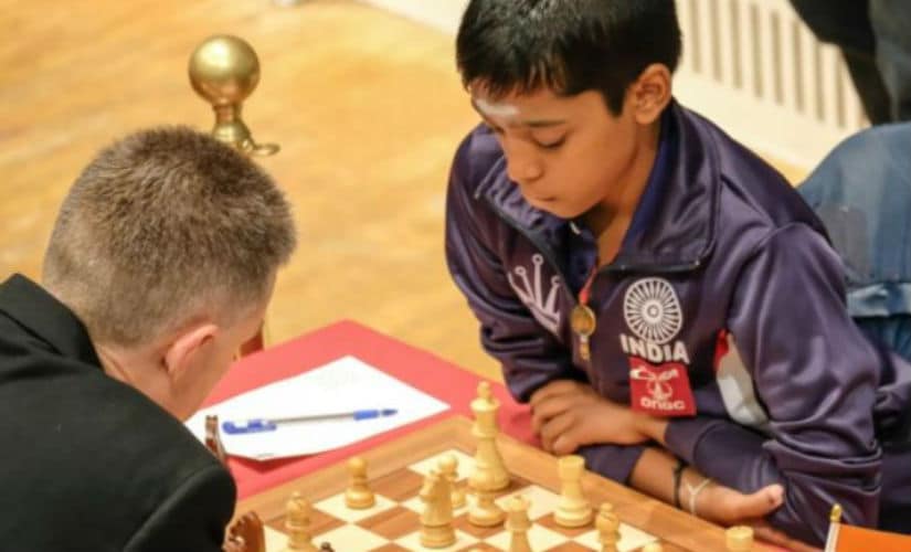 Praggnaanandhaa (R) in action against Michael Adams. John Saunders