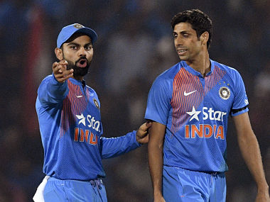 File image of India captain Virat Kohli alongside pace bowler Ashish Nehra. AFP 