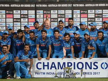 Indian cricket team pose with the trophy after winning the fifth ODI and clinching the series 4-1. AFP