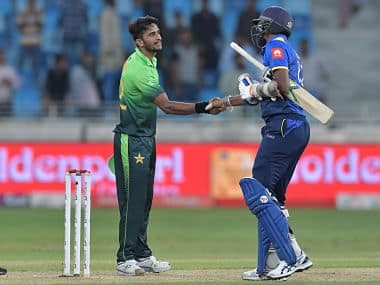 Pakistan’s Hasan Ali (L) and Sri Lanka’s Suranga Lakmal shake hands at the end of the first one day international (ODI) cricket match between Sri Lanka and Pakistan at Dubai International Stadium in Dubai on October 13, 2017. / 