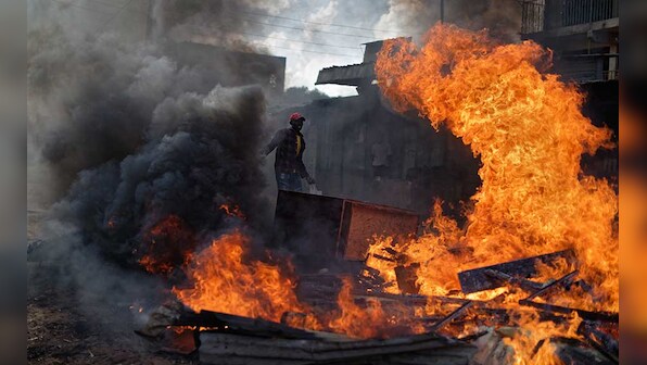 Kenya delays poll in opposition strongholds as clashes continue between police and protesters