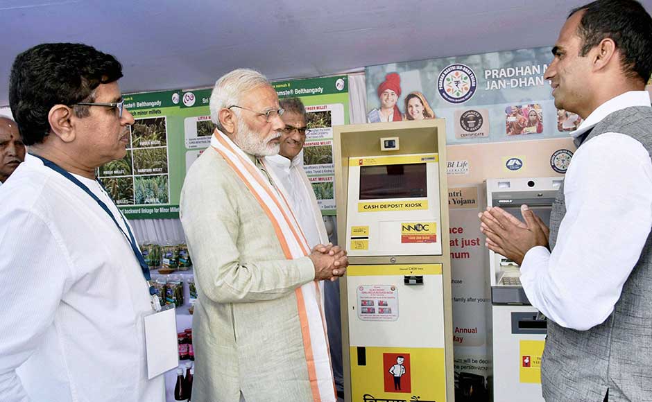 Modi launched the digitised cashless Self-Help Groups (SHG) transactions in the state charitable trust of the Sree Kshetra Dharmastala Rural Development project. Prime Minister Narendra Modi visiting Self Help Group product stalls and E- Lobby of Vijaya Bank at Ujire in Karnataka on Sunday. PIB Modi launched the digitised cashless Self-Help Groups (SHG) transactions in the state charitable trust of the Sree Kshetra Dharmastala Rural Development project. Prime Minister Narendra Modi visiting Self Help Group product stalls and E- Lobby of Vijaya Bank at Ujire in Karnataka on Sunday. PIB
