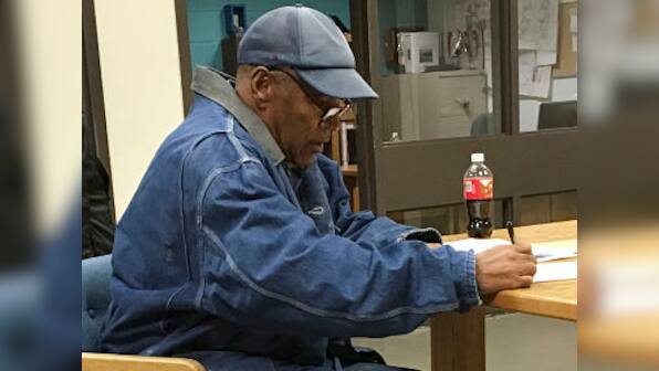 OJ Simpson released on parole after serving nine years for armed robbery; plans to relocate to Florida