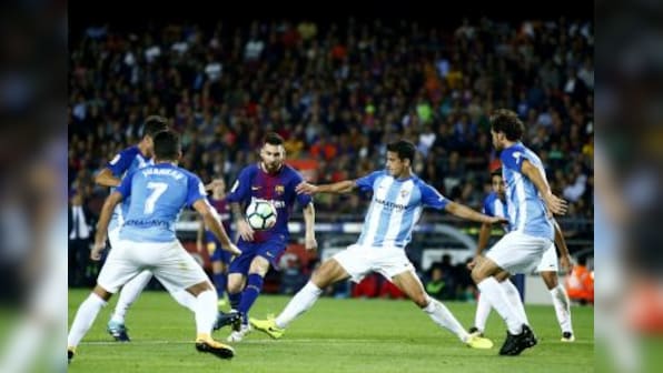 La Liga: Barcelona stride past Malaga to consolidate top spot amidst Catalan chaos; Valencia thrash Sevilla