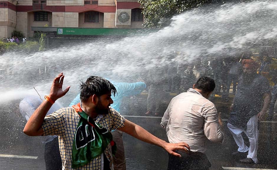 Police disperse crowds with water cannons. After Amit Shah on Sunday, Union ministers Kiren Rijiju and General VK Singh led the rally for BJP on Monday. PTI Police disperse crowds with water cannons. After Amit Shah on Sunday, Union ministers Kiren Rijiju and General VK Singh led the rally for BJP on Monday. PTI