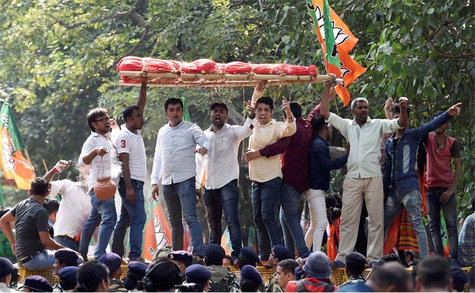 Party workers take out a mock funeral procession of the Kerala government during their Janaraksha Yatra outside the CPM office in New Delhi. PTI Party workers take out a mock funeral procession of the Kerala government during their Janaraksha Yatra outside the CPM office in New Delhi. PTI
