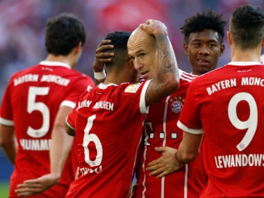 Bayern Munich's Thiago Alcantara celebrates scoring their third goal with Arjen Robben and team mates. Reuters