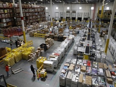 Workers prepare to move products at an Amazon fulfillment center in Baltimore. Image: AP Photo/Patrick Semansky