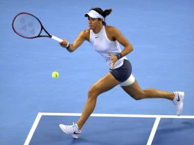 Caroline Garcia of France hits a return shot against Simona Halep of Romania in their women’s singles championship match in the China Open tennis tournament at the Diamond Court in Beijing, Sunday, Oct. 8, 2017. (AP Photo/Mark Schiefelbei