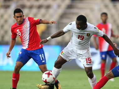Naby Bangoura of Guinea battles with Karin Arce of Costa Rica during their Group C clash. Getty