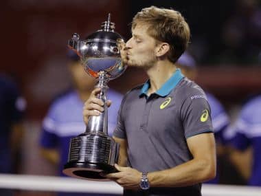 David Goffin of Belgium poses with the trophy after beating Adrian Mannarino of France during their men&rsquo;s singles final match of the Japan Open tennis tournament in Tokyo, Sunday, Oct. 8, 2017. (AP Photo/Shizuo Kambayashi)