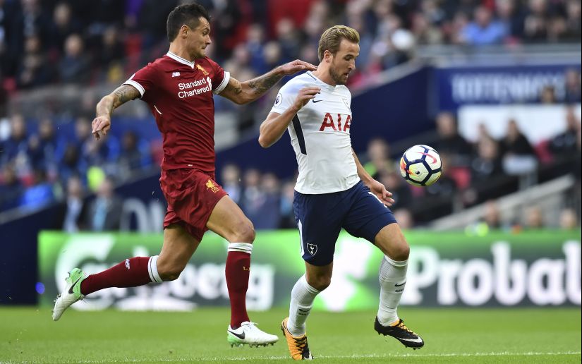 Tottenham Hotspur's Harry Kane (R) vies with Liverpool's Dejan Lovren during their Premier League match. AFP