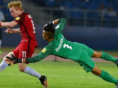 Indian goalkeeper Dheeraj Singh fails to save as USA's Carleton scores the 3rd goal against India during their U-17 FIFA World cup match against USA in New Delhi. PTI