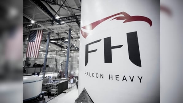 SpaceX's Falcon Heavy rocket raised up on Cape Canaveral launchpad; to set of on mission next month