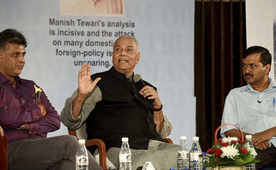 Senior BJP leader Yashwant Sinha on Thursday shared dais with Chief Minister of Delhi Arvind Kejriwal at a function organised for release of Congress' Manish Tewari's book 'Tidings of Troubled Times'. PTI Senior BJP leader Yashwant Sinha on Thursday shared dais with Chief Minister of Delhi Arvind Kejriwal at a function organised for release of Congress' Manish Tewari's book 'Tidings of Troubled Times'. PTI