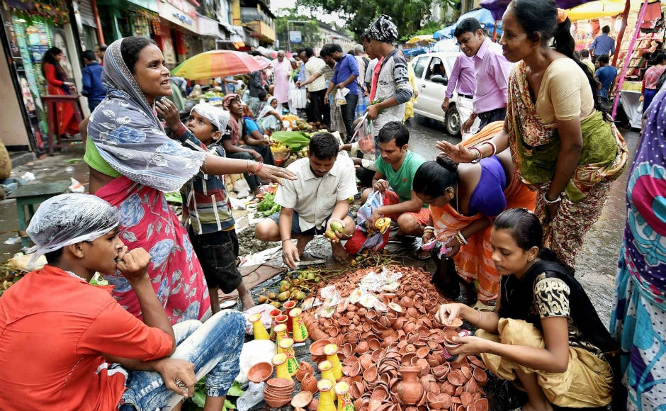 There was festive spirit during the day with people thronging the markets for last-minute shopping. Markets were flooded with decorative items, diyas and marigold flowers. AP There was festive spirit during the day with people thronging the markets for last-minute shopping. Markets were flooded with decorative items, diyas and marigold flowers. AP