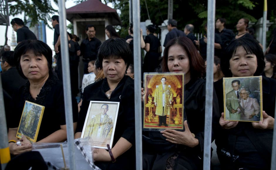 Black-clad mourners thronged Bangkok’s historic quarter before dawn, as Thailand plunged into a year of griveing after the death of Adulyadej, whose reign lasted for seven decades. Reuters Black-clad mourners thronged Bangkok’s historic quarter before dawn, as Thailand plunged into a year of griveing after the death of Adulyadej, whose reign lasted for seven decades. Reuters