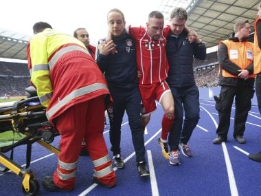 Bayern's Franck Ribery center is helped after he got injured during the match against Hertha. AP