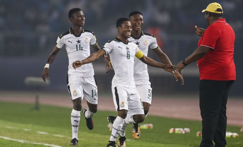 Ghanaian players celebrate with coach Samuel Fabian. Getty Images