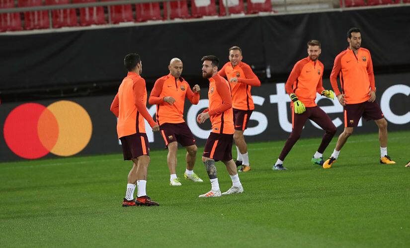 Barcelona's Lionel Messi, third left with teammates during a training session at Georgios Karaiskakis stadium at Piraeus port, near Athens, on Monday, Oct. 30, 2017. Barcelona will play against Olympiakos for the Champions League group D soccer match on Tuesday. (AP Photo/Petros Giannakouris)