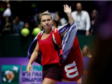 Simona Halep waves goodbye to the crowd after her group stage defeat against Elina Svitolina. Reuters