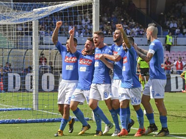 Napoli's Dries Mertens, second from left, celebrates with teammates after scoring during a Serie A match soccer match between Napoli and Cagliari at the San Paolo stadium in Naples, Italy, Sunday, Oct. 1, 2017. (Ciro Fusco/ANSA via AP)