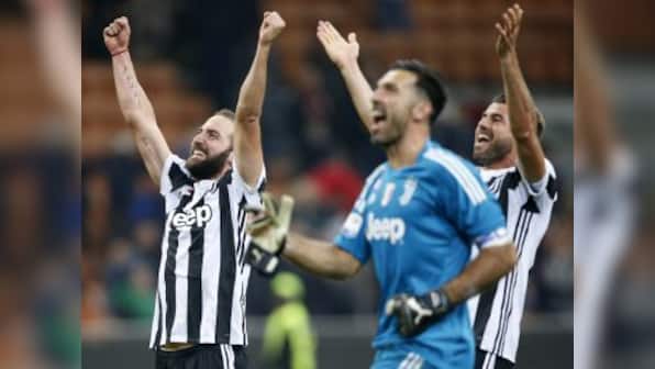 Serie A: Gonzalo Higuain crosses 100-goal milestone as Juventus bury AC Milan; AS Roma hold off Bologna